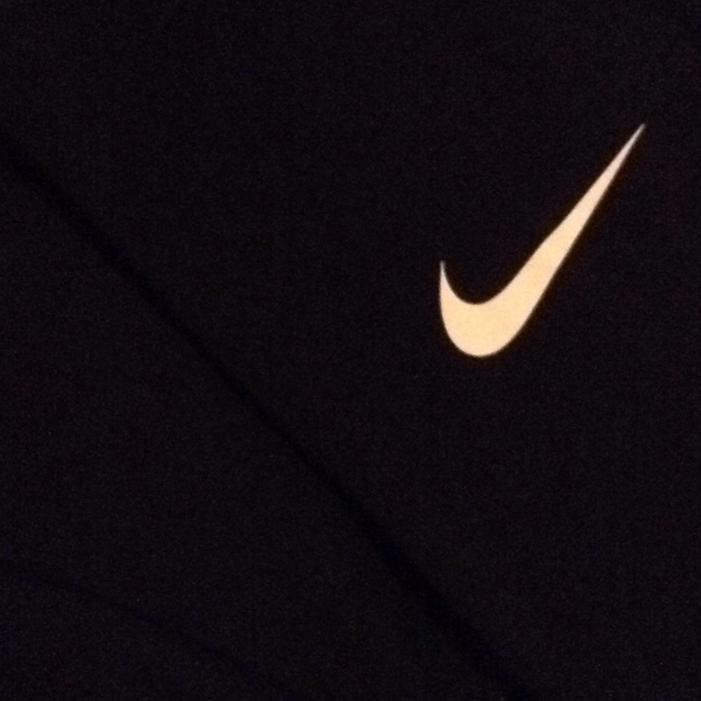 Dri-fit , fitted black long sleeve Nike shirt.